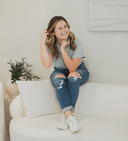 Girl with ADHD laughs on couch