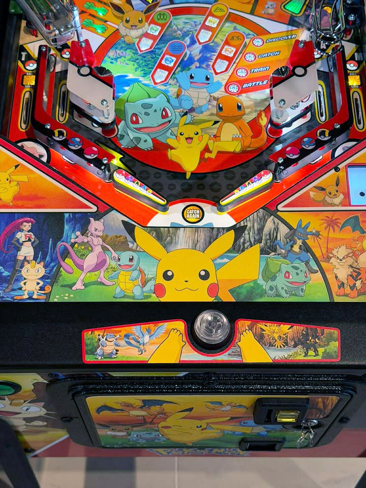 Stern Pokémon pinball machine with vibrant Pokémon art mods by Wizard Mod.
