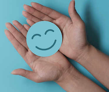 Hand holding paper cut smile face, positive thinking, mental health assessment , world men