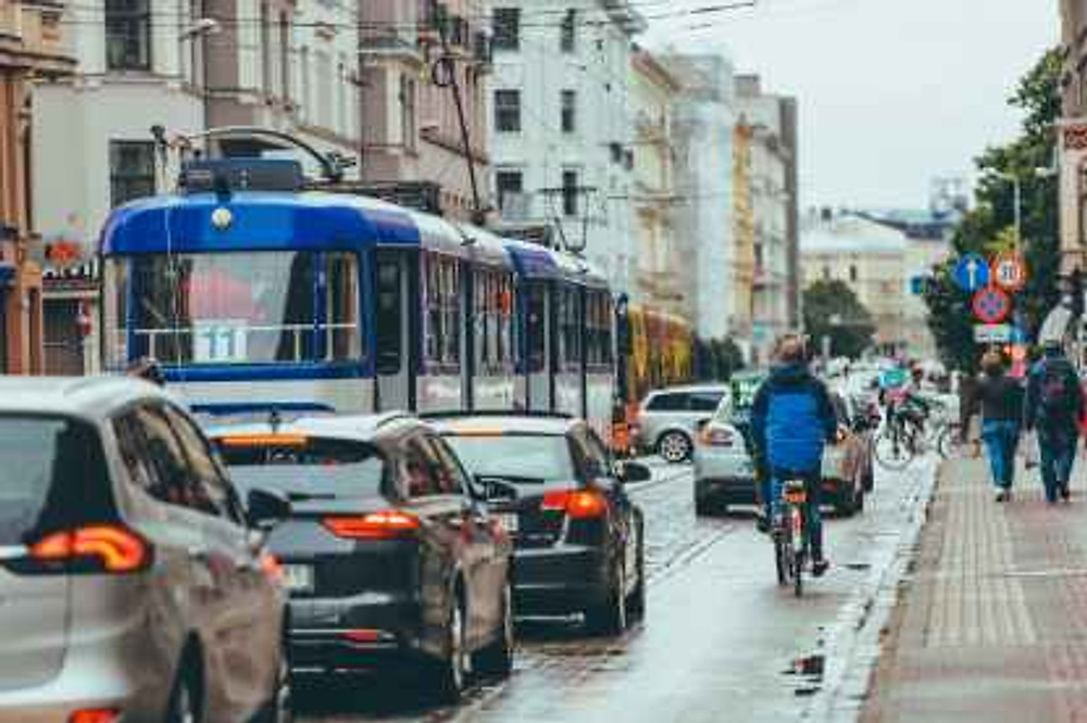 tram and cars in traffic jam at rush hour