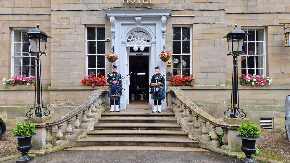 John and Ross outside the main entrance, about to play for the guests arrival