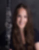 Smiling woman holding a clarinet