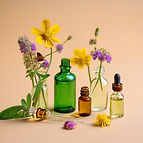 a selection of beautiful wildflowers, along with three small-mouthed bottles with dropper