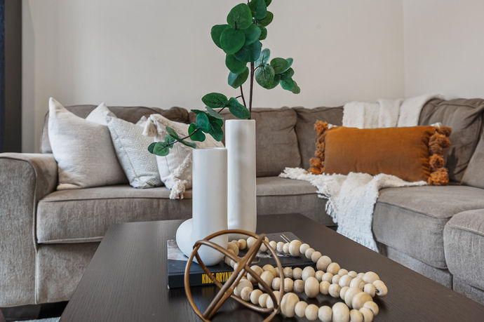 Cozy living room with textured furniture and stylish accents.