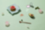 Composition of food product and skincare products over mint green background