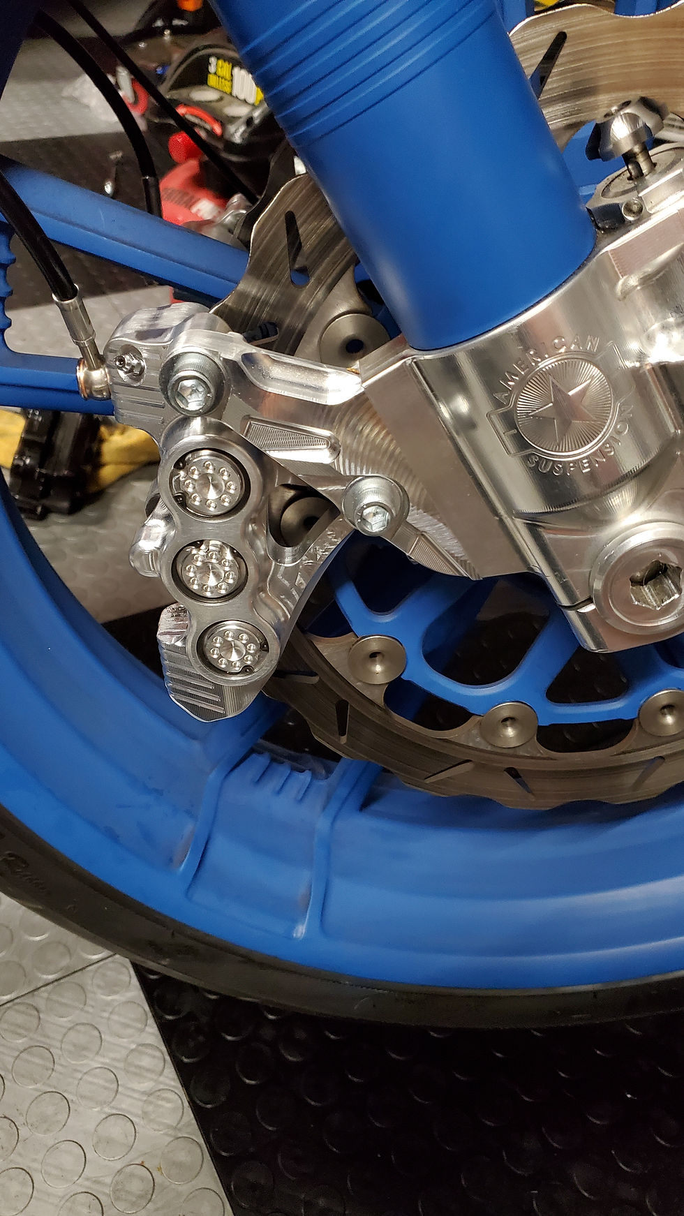 Thumbnail: Close-up of polished chrome motorcycle brake caliper