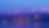 City view with landscape of mountains in the distance.
