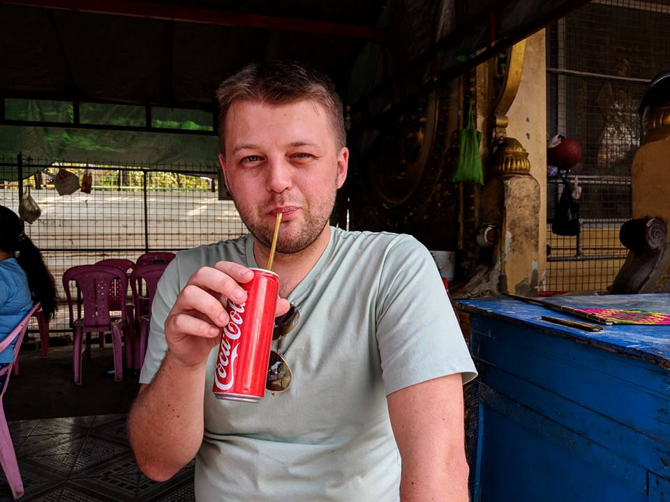 Tutor drinking a can of coke