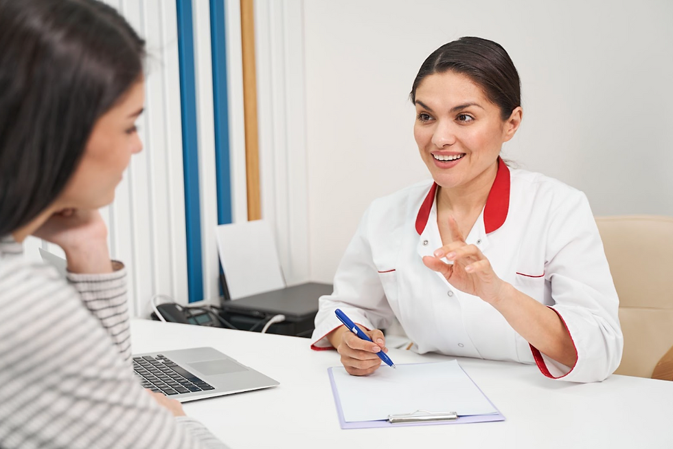 Woman in a striped shirt talking with a nurse about why it’s important to know how common is syphilis in Missouri.