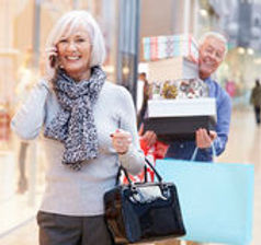 senior-woman-shopping-mall-as-husband-ca