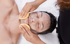 Professional facial being performed on a male client