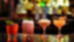 Line up of 4 cocktail on a bar