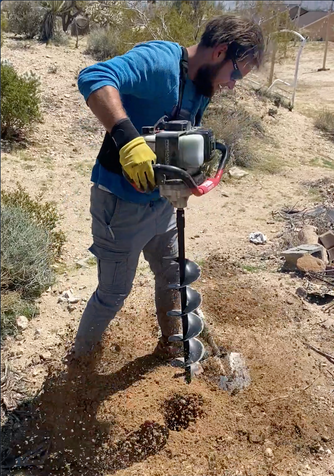 Digging holes for our posts