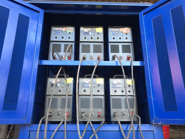 A rack of Weld King high frequency welding machines.