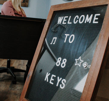 Welcome to 88 Keys Academy sign in the music studio lobby