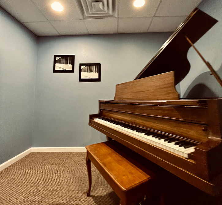 A grand piano sits inside of a music lesson studio room at 88 Keys Academy in O'Fallon Illinois