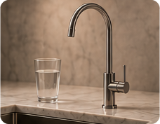 Stone benchtop drilled for a filtered water tap with a clean professional finish.