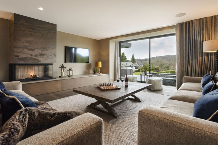 living room with large fire place with views 