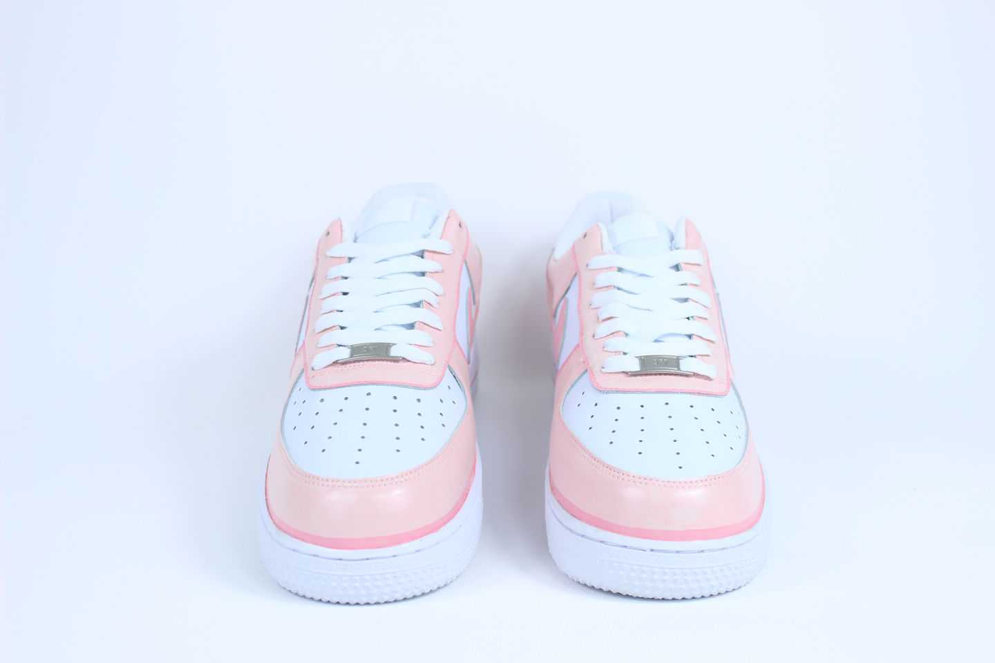 Side view of Pink Drip custom Nike Air Force 1 sneakers with vivid pink paint dripping over clean white leather base