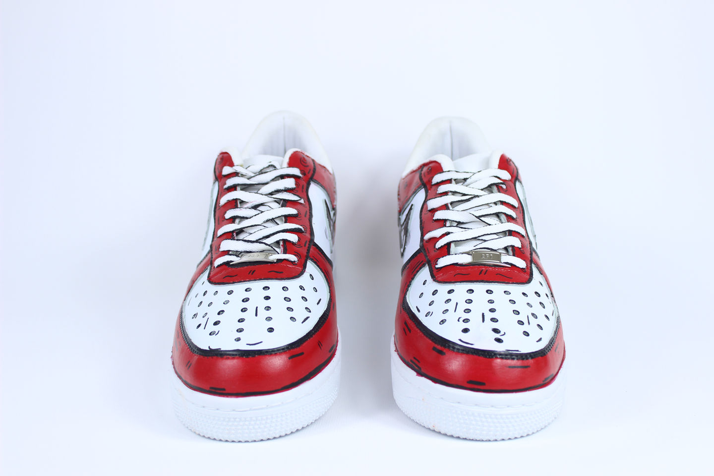 Side view of Red Cartoon custom Nike Air Force 1 sneakers with comic-style red outlines and animated design on white leather