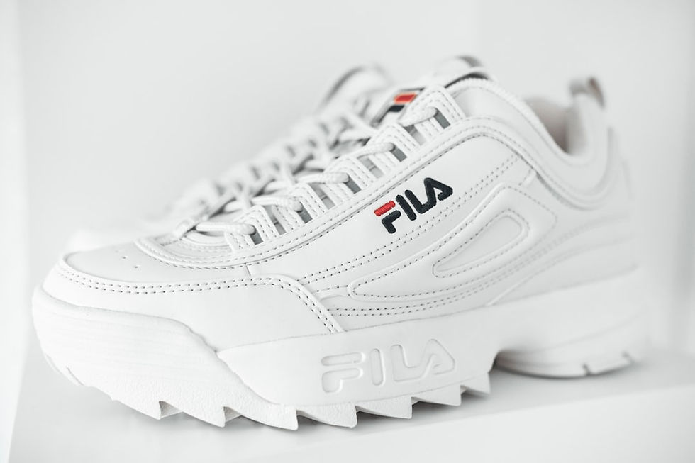 Different tools and paints laid out for sneaker customization