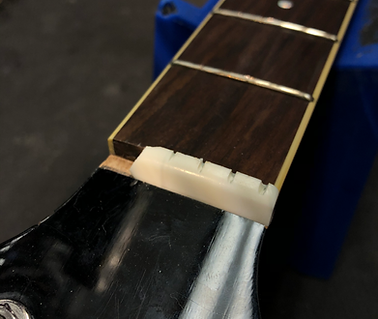 broken acoustic guitar nut