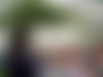 Teacher guiding underprivileged students in an informal setting.