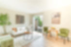 Bright staged living room with natural light and modern accents