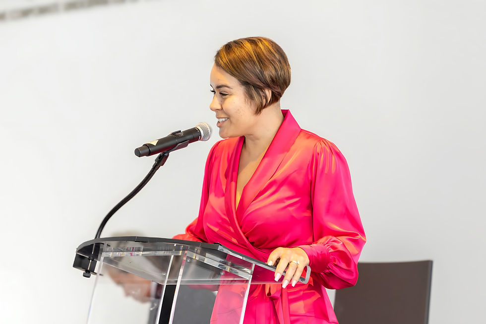 Latina keynote speaker addressing an audience on leadership and equity