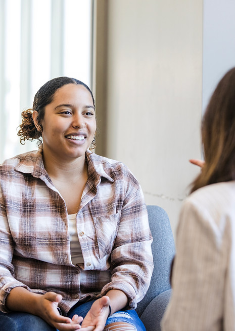 Diverse professionals engaging in leadership and mentorship conversation