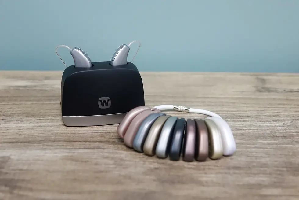 Widex hearing aids in a charger and various color options