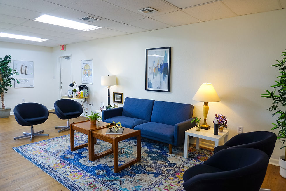 Modern waiting room with blue sofa and chairs in Winter Haven.