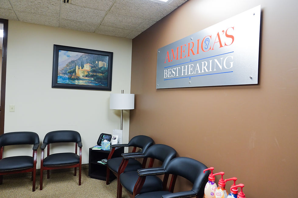 America's Best Hearing waiting area with black chairs.