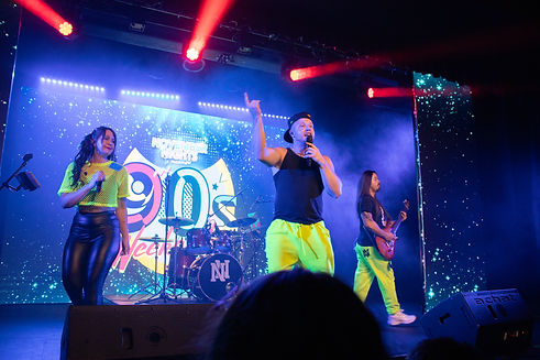 Noughty Nineties performing energetic 90s and 00s party set at a 90s and 00s weekender