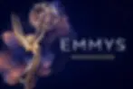 Gold Emmy statuette beside text Emmys Nominations on a dark blue, starry background with fireworks-like burst.