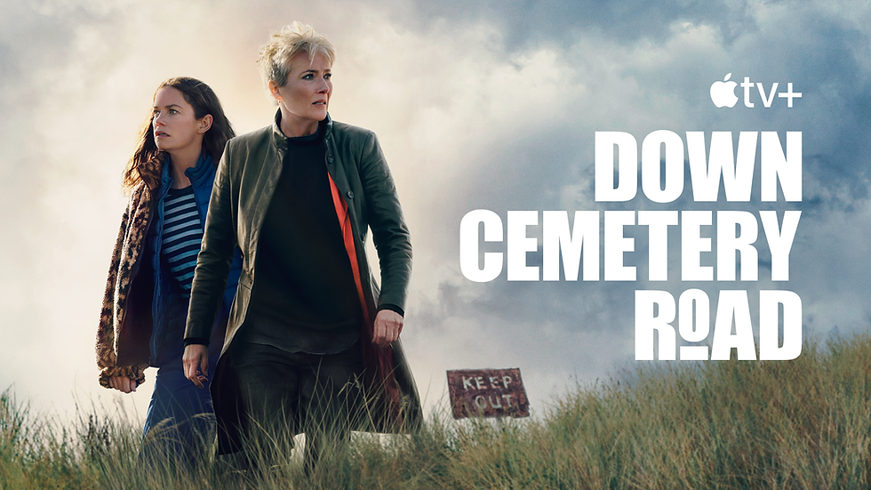 Two people stand in a grassy field with cloudy skies. A "Keep Out" sign is visible. Text reads "Down Cemetery Road" with the Apple TV+ logo.