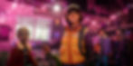 Animated scene of four kids in a festive garage, lit with pink string lights. A boy in an orange vest smiles, holding gadgets. Rock ‘N Roll sign.