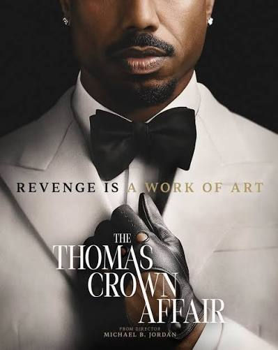 Michael B. Jordan in a white tuxedo and black bow tie, gloved hand at chest, with The Thomas Crown Affair and Revenge Is a Work of Art.