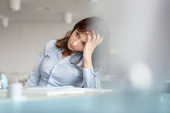 A stressed woman at a desk