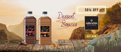 a bottle of caramel sauce sits on a wooden table