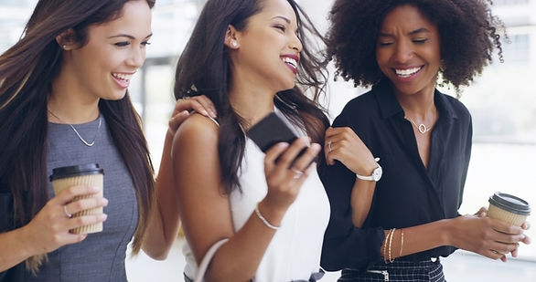 women-employees-smile-office-coffee-break-with-fun-bonding-support-new-york-diversity-peop