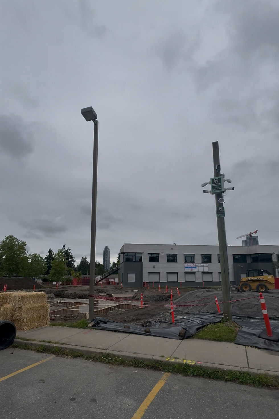 Eye-level view of a modern surveillance camera monitoring the construction zone
