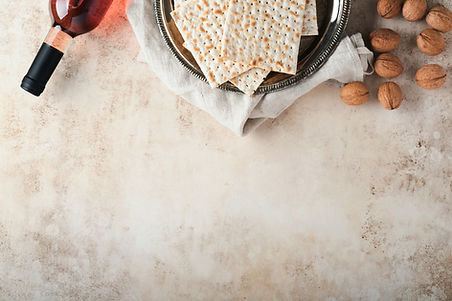 Passover celebration concept. Matzah, red kosher and walnut. Traditional ritual Jewish bre