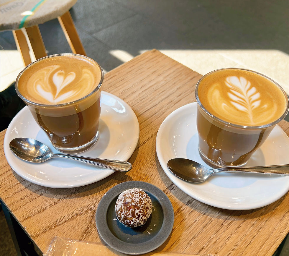 Cafe lattes and a coconut bliss ball at allpress in Kiyosumi Shirakawa