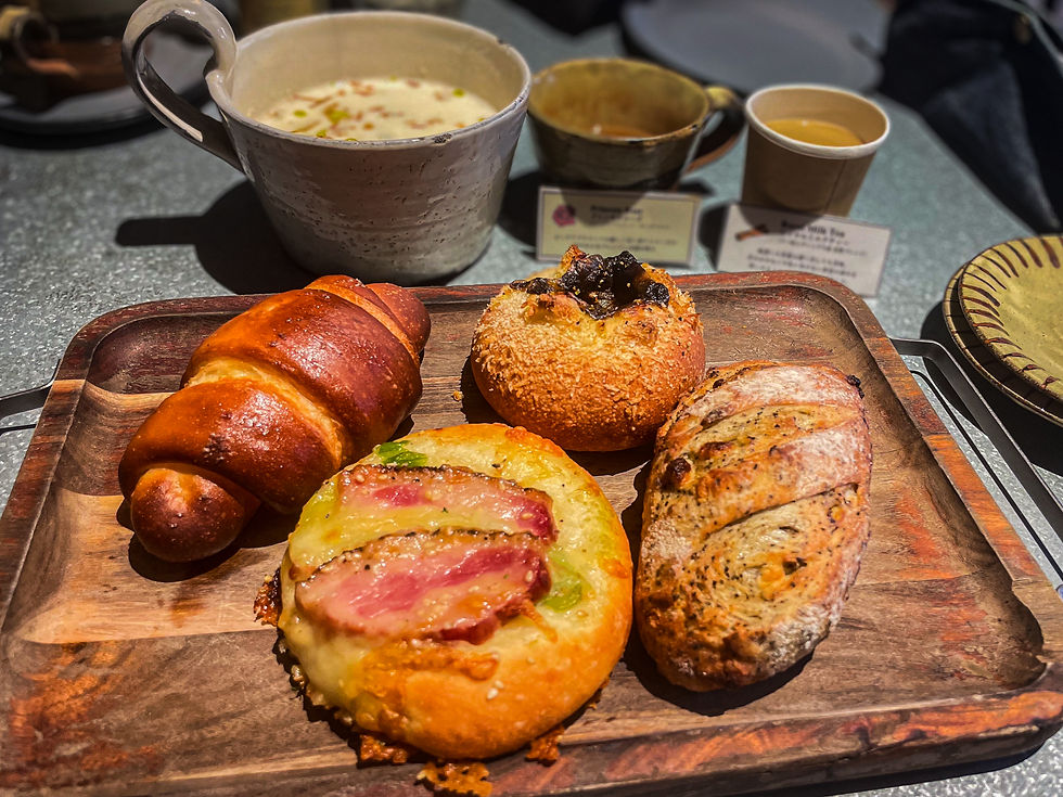 Four different types of bread at flour + water along with a soup.