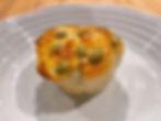 A small Japanese edamame cheese bread on a white plate.