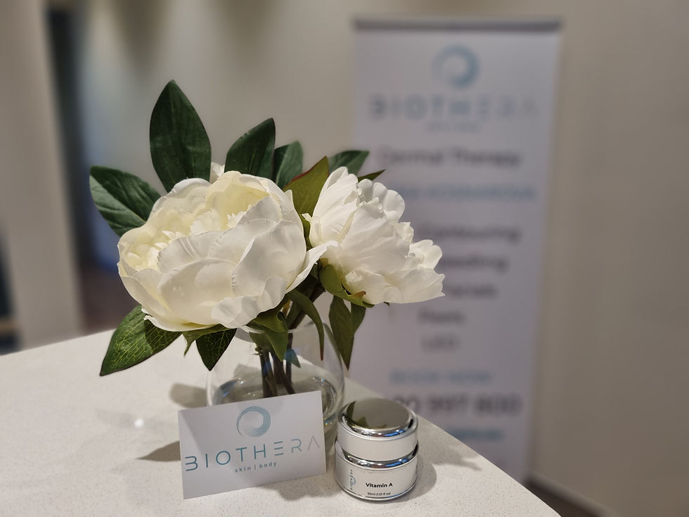 Close-up view of a Biothera skin treatment product on a white surface