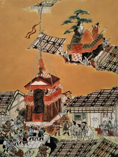 洛中洛外図に描かれた祇園祭の山鉾。町家の屋根の間を進む