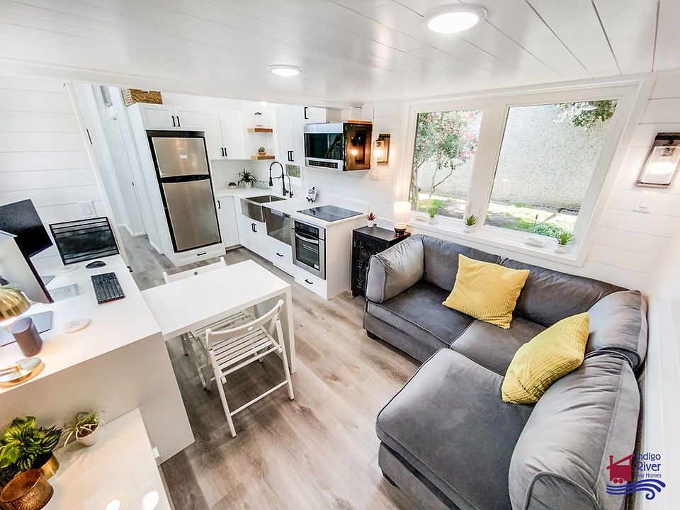 Interior shot of 32' Tiny Home on Wheels built by Indigo River Tiny Homes Living Area & Kitchen