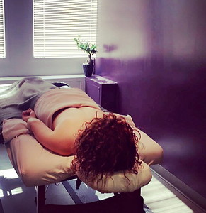 Patient on chiropractic table laying down